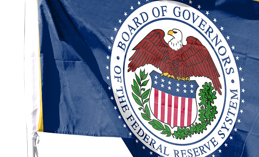 Close-up of the Federal Reserve flag. inflation. Rising interest rate conceptual image