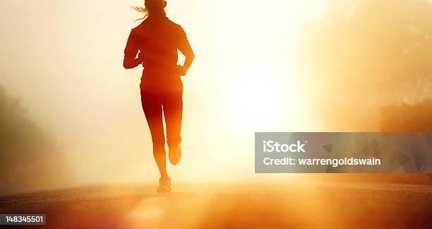 Athlete Running Road Silhouette Stock Photo - Download Image Now - Running, Sunrise - Dawn, Women