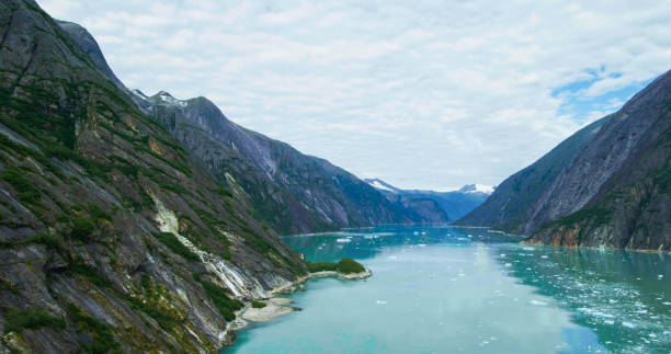 istock Rocks, melting ice, glaciers, rivers, forests and mountains seen from above. 1483459929