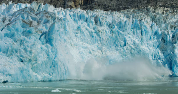 istock Spectacular glacier calving. Ice cubes fell into the water like an explosion. 1483459934