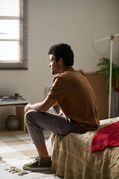 istock Guy staying alone in his room 1483466769