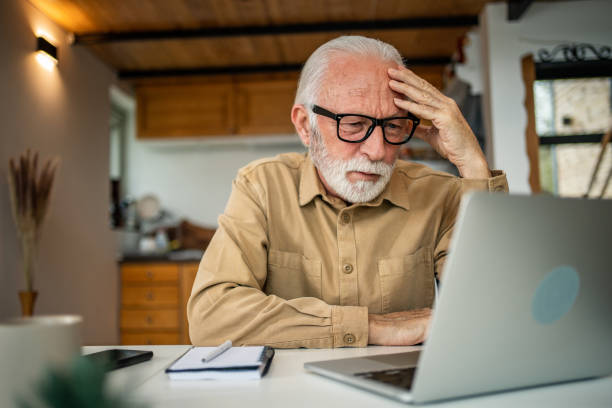 istock An elderly man, a pensioner, learns online, he spends his retirement days studying online, thus continuing his activities and still perfecting his skills. 1483467433