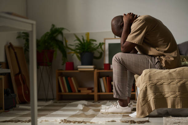 istock Young man in depression sitting in the room 1483467544