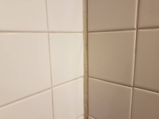 istock dry white tile caulk in bathroom or kitchen wall 1483467965