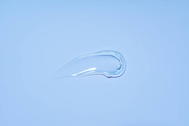istock Cosmetic cream transparent liquid gel serum texture with micro bubble on blue background beauty concept 1483468105