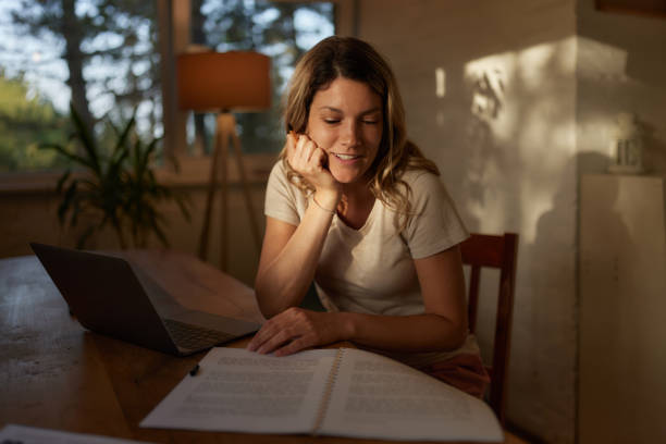 istock Happy adult student learning from textbook at home. 1483472091
