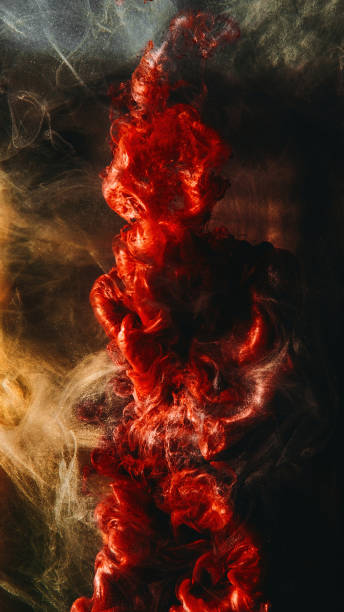 istock Paint drop ink water vapor cloud red golden haze 1483472276