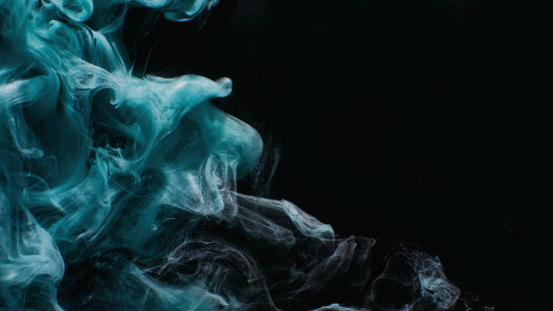 istock Ink water mist floating blue glitter fog on black 1483472303