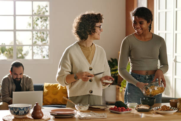 istock Mother cooking together with her adopted daughter 1483472468
