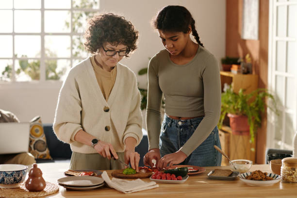 istock Mom preparing breakfast with her daughter 1483472536