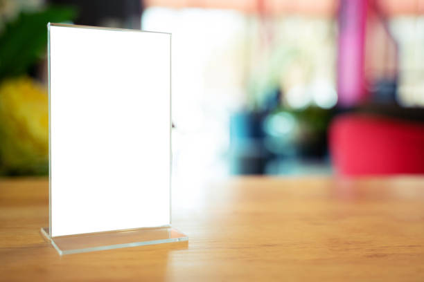 istock Mock up Menu frame standing on wood table in Bar restaurant cafe. space for text 1483472813