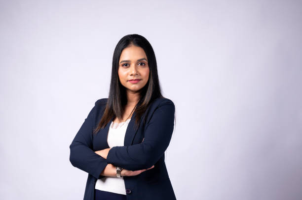 istock Smiling young woman professional in formal wear with arms crossed and looking at camera 1483473239