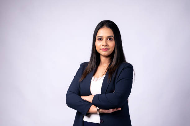 istock Smiling young woman professional in formal wear with arms crossed and looking at camera 1483473240