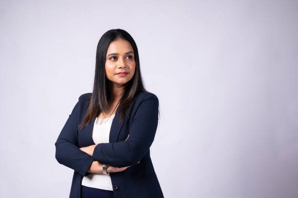 istock Smiling young woman professional in formal wear with arms crossed and looking at camera 1483473243