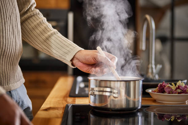 istock Close up of a black bachelor cooking lunch. 1483474103