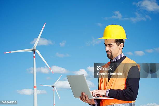 Technician Engineer In Wind Turbine Power Generator Station Stock Photo - Download Image Now