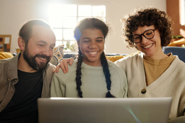 istock Happy family having video call on laptop 1483476564