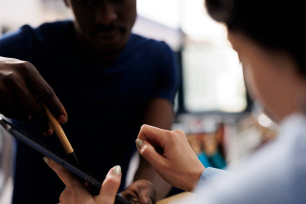 istock Store worker signing online repor 1483477855