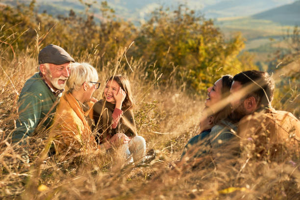 istock Happy multi-generation family talking in autumn day on a hill. 1483478037