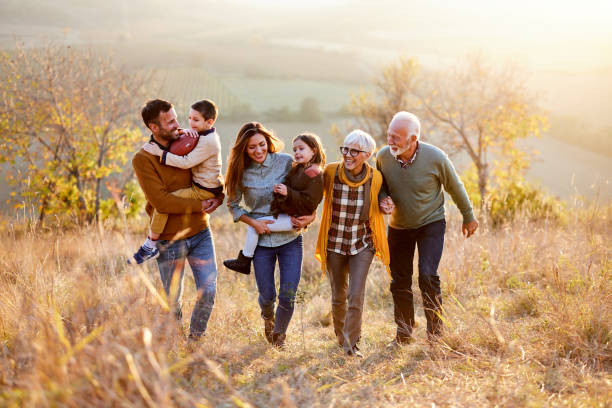 istock Happy multi-generation family taking a walk on the field. 1483478182