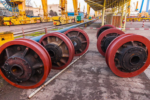 New steel wheels with gears for a harbor crane.
