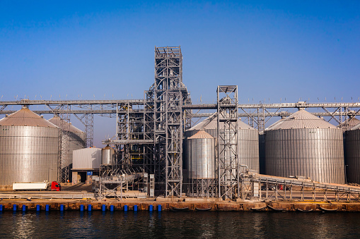 Grain storage terminal with storage tanks and loading lines in the seaport of Constanta Romania.