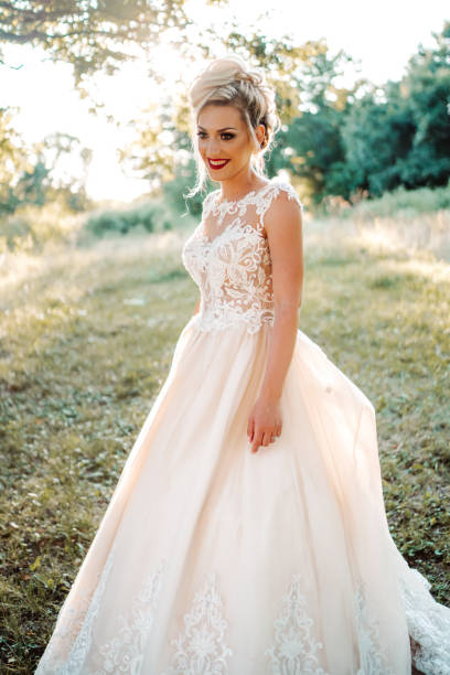 istock Beautiful young bride enjoying sunny day in nature 1483484139
