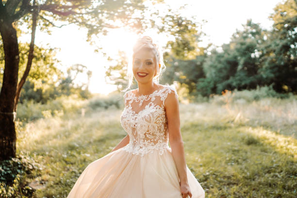 istock Beautiful young bride enjoying sunny day in nature 1483484247
