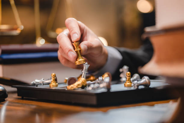 istock Leadership strategy or strategic planning and human resources organization risk management, Hand choose king chess fight game concept of challenge or team player or business success leadership team 1483488903