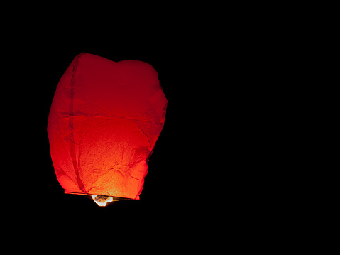 Red Thai sky lantern released in Bangkok during the Loi Krathong festival