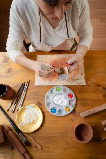 istock Woman painting a pottery 1483493905
