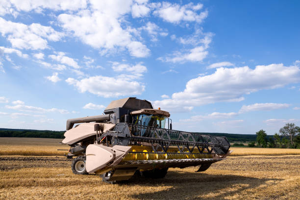 istock A modern combine harvester stands on the field during harvesting withe the hinged frame cutterbar draper combine header. 1483495027