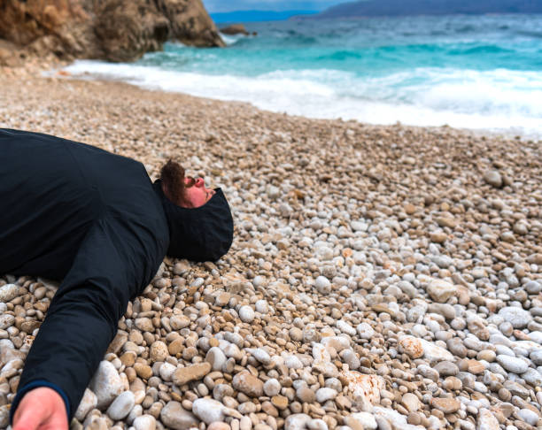 istock A man with a beard lies on the beach 1483496110