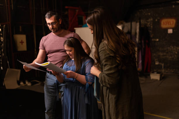istock Young woman with down syndrome practicing her lines with her colleagues before a performance 1483496886