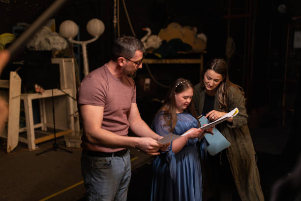 istock Young woman with down syndrome practicing her lines with her colleagues before a performance 1483497220