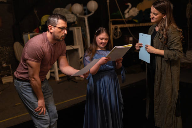 istock Young woman with down syndrome practicing her lines with her colleagues before a performance 1483497263