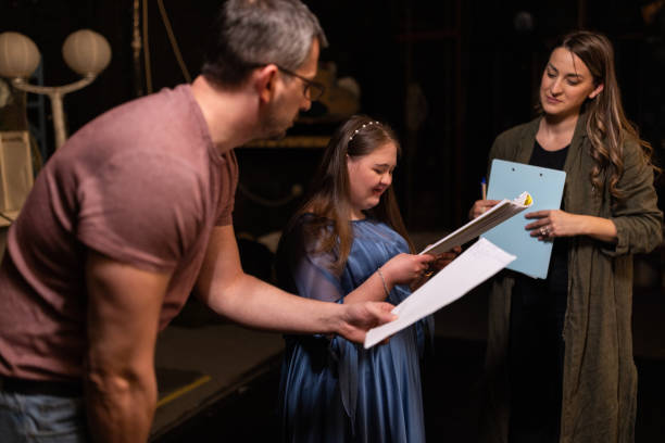 istock Young woman with down syndrome practicing her lines with her colleagues before a performance 1483497271