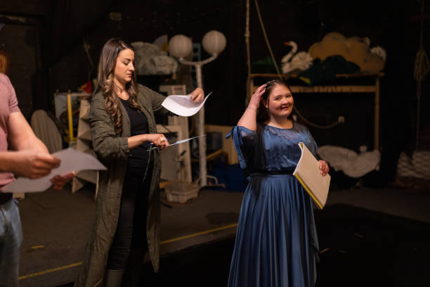 istock Young woman with down syndrome practicing her lines with her colleagues before a performance 1483497275