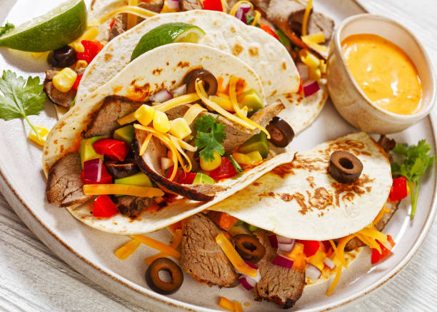 istock Beef Steak Tacos with veggies, avocado, corn 1483497566