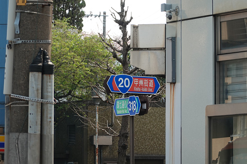 Toyako-cho, Japan - June 8, 2023: Multilingual directional signs point to different sites in the active volcanic landscape in the Mount Usu and Lake Toya area.