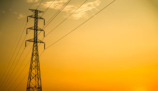 istock High Voltage Pole on Sunset Background,Line Electric Energy Power Station Tower Hight Voltage Transmission electrician Grid,Danger Technology Construction Plant,Substation Pylon Industry Generator 1483499674