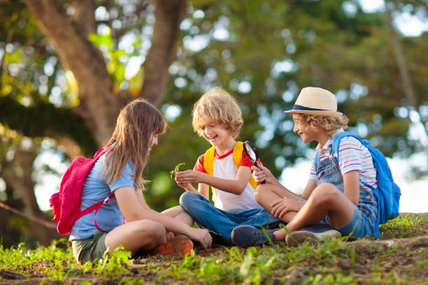 istock Kids explore nature. Children hike in sunny park. 1483499728