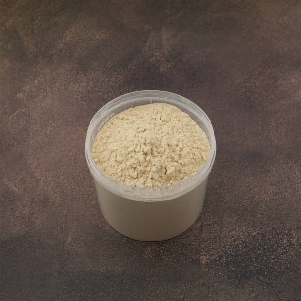 Soy Protein isolate in transparent plastic box. Pure powder Soy Protein isolate in transparent plastic box. Pure powder isolated from soybean used in food industry. Soya flour. Food additive often consumed as additional source of energy. tsp stock pictures, royalty-free photos & images
