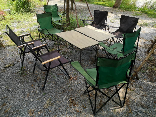 istock Camping chairs and portable table on the garden. 1483500868