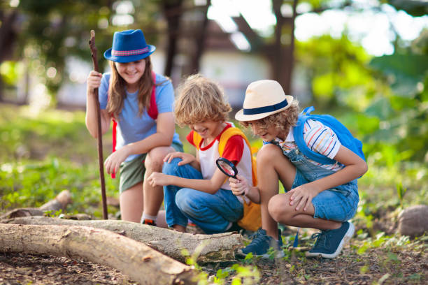 istock Kids explore nature. Children hike in sunny park. 1483501642