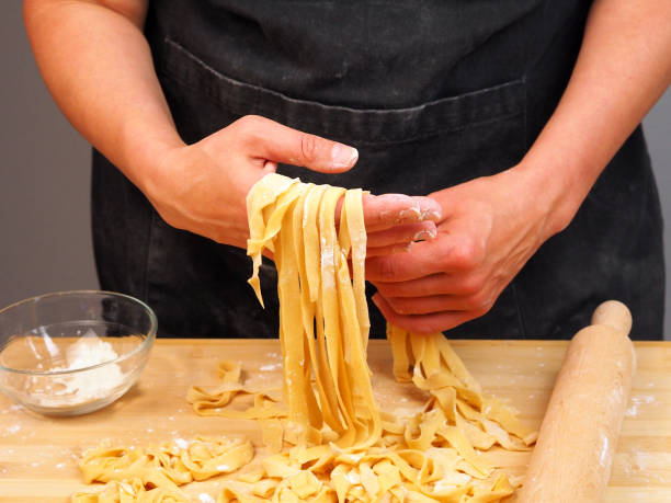 istock Chef prepares noodles at home in the kitchen 1483504910