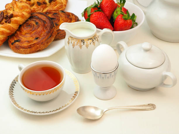 istock Continental breakfast with egg, tee, milk, buns, strawberry 1483504928