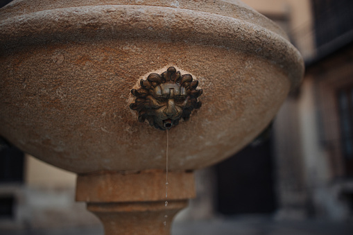 Rome, Italy - October 11, 2007: The Fountain of Neptune in Piazza Navona designed in 1574 by Giacomo Della Porta. The popular Piazza Novona in Rome goes back to ancient Roman times when it was the site of the Stadium of Domitian which was built in the first Century AD. The Piazza was transformed into a significant example of Baroque Roman Architecture during the reign of Pope Innocent X who reigned from 1644 to 1655 AD. Today it is a very popular Roman square where many artists display their paintings for sale to visitors. Photo shot in the afternoon sunlight; horizontal format.