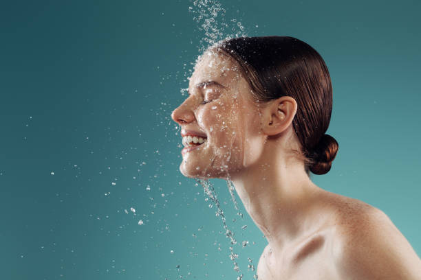 Girl washes her face
