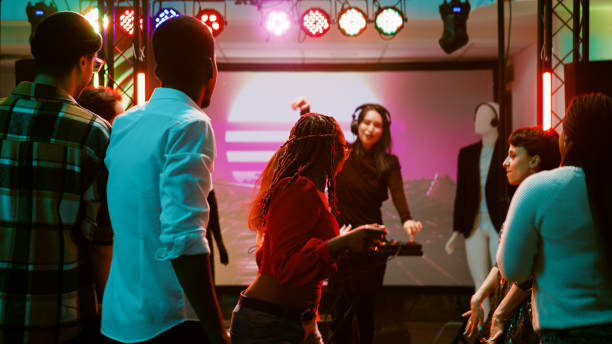 istock Men and women dancing at disco party 1483506787